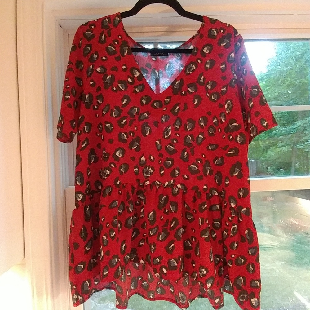 Animal print blouse with hi-lo flounce
